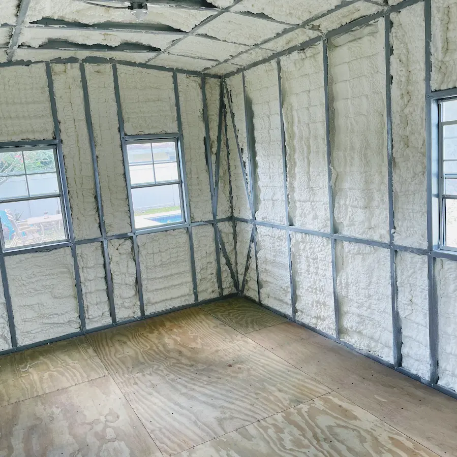 Closed-cell spray foam insulation applied to wall cavities in a residential project in Volney